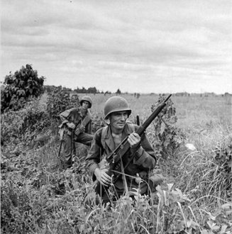 An Army sniper and his observer clearing an area on Luzon, in the Philippines in 1945. U.S. Army Photo.