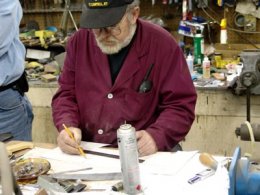 The knifemaking process starts with a design. Gil draws and refines his design on paper. If it is for a popular Hibben style, he may make a plastic or wooden template of the basic blade size and shape.